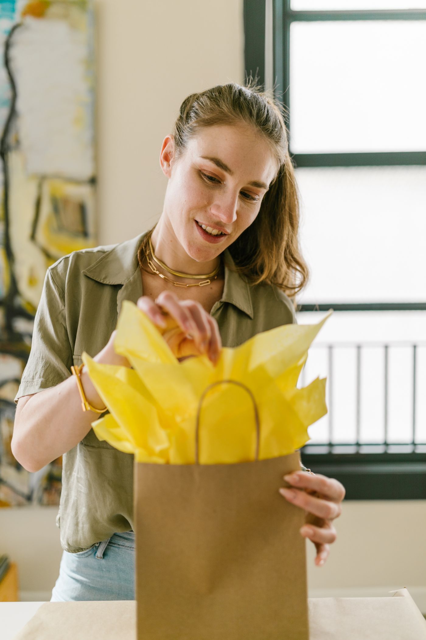 A small business owner packing a customer order