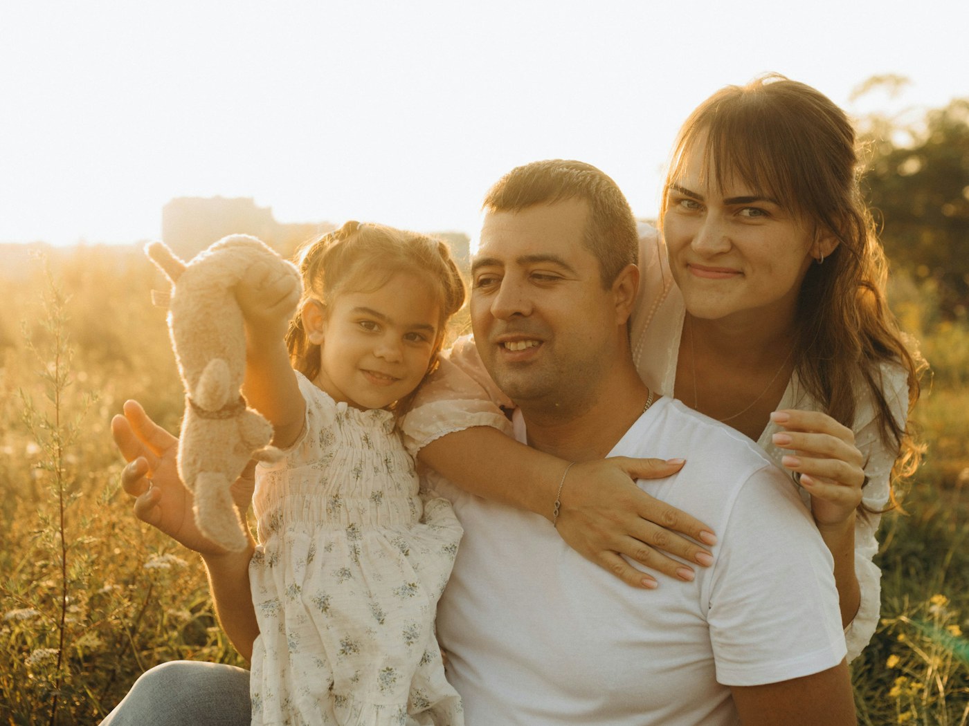A family sitting together outdoors