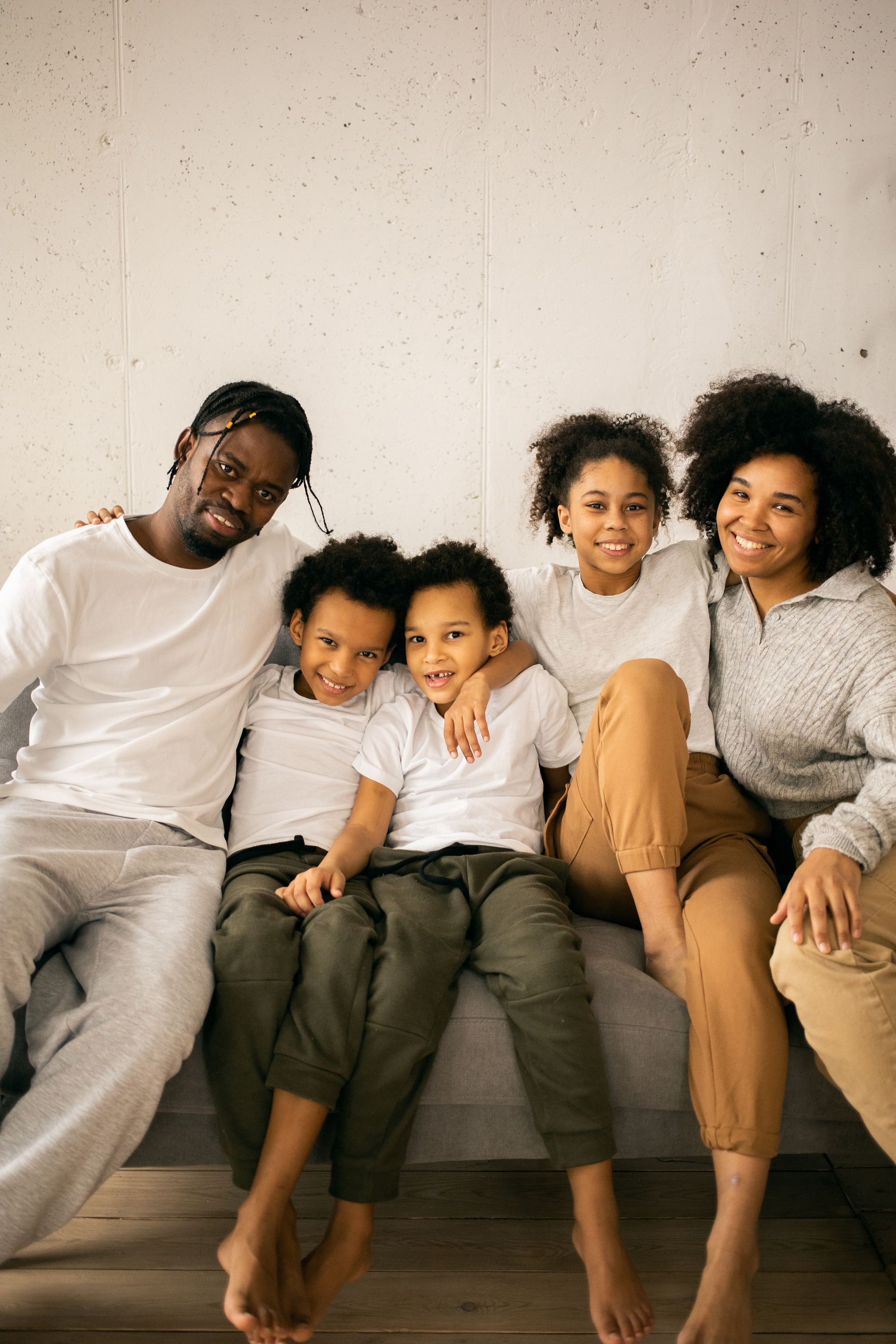 A Black family relaxing together at home